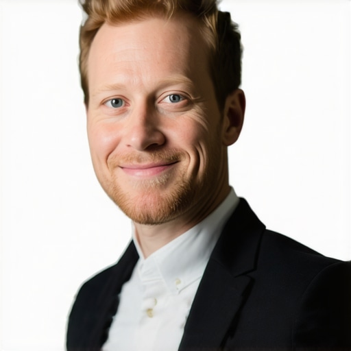 A high-quality professional business profile photo showing a confident, friendly person with a clean background.